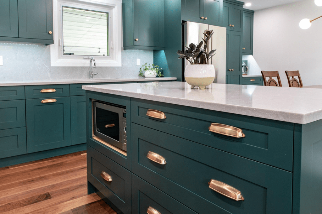 green kitchen cabinets with brass hardware