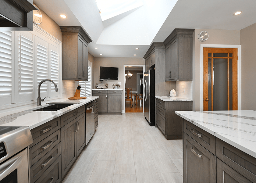 galley kitchen with upper cabinets