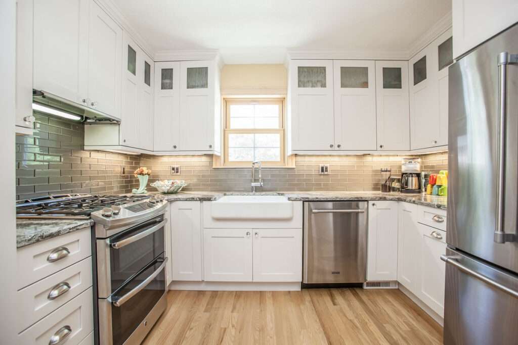 white frame cabinets with interior lighting