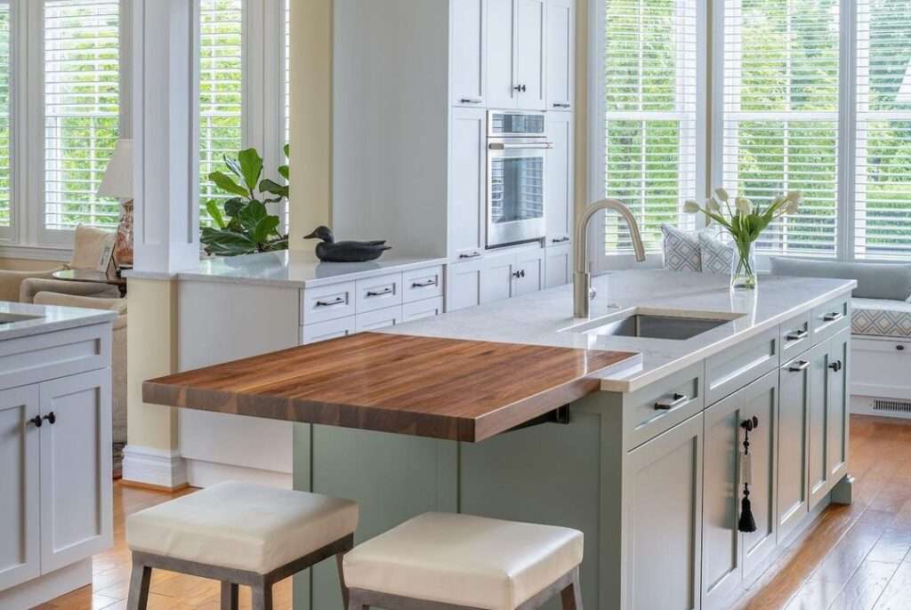 white kitchen cabinets with accent island